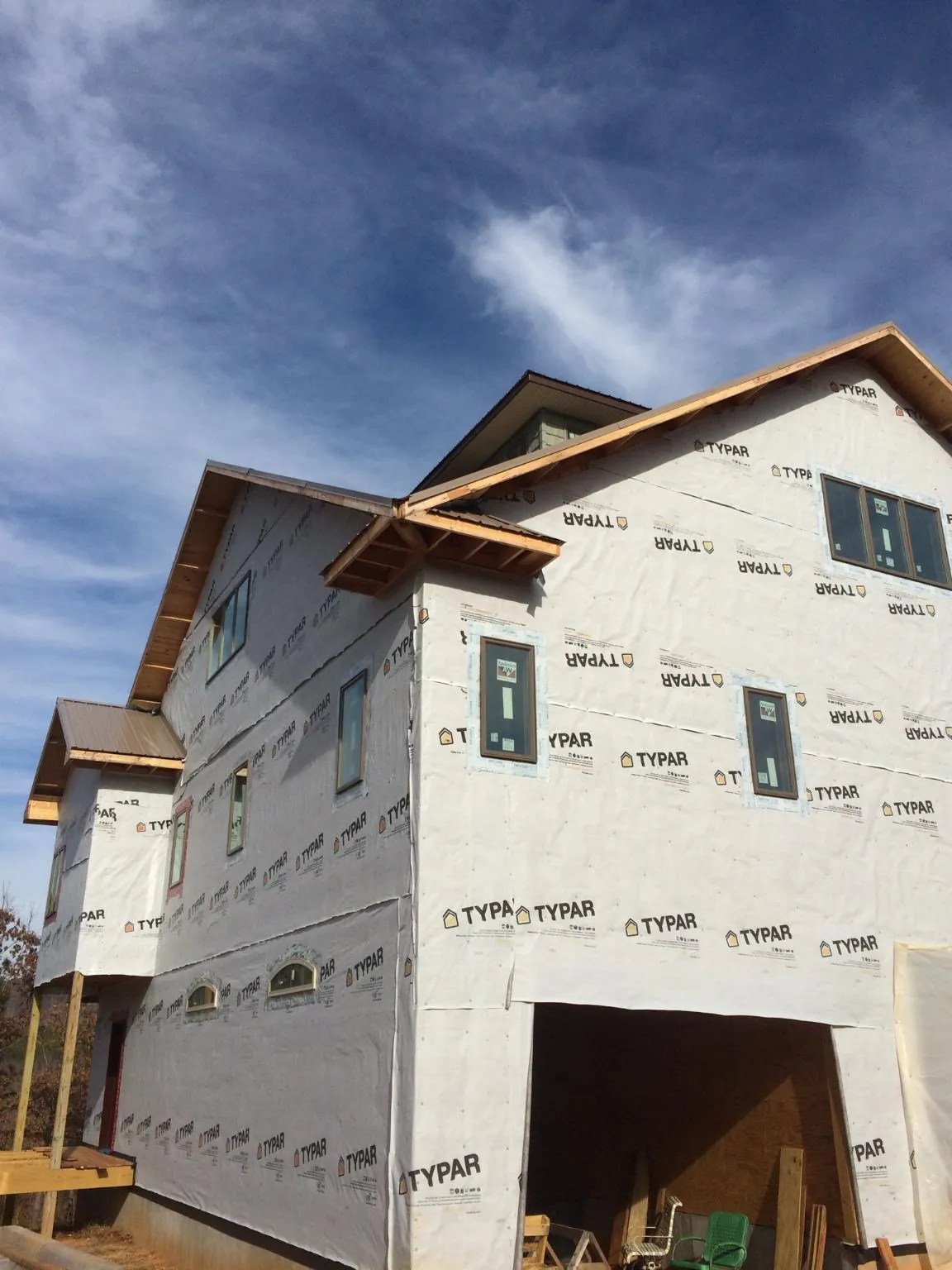 Stick built house wrapped in Typar with new roof framing and dormers in Woodhull
